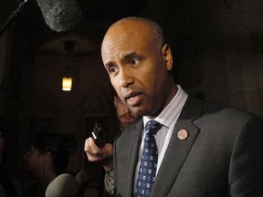 Minister of Immigration, Refugees and Citizenship Ahmed Hussen speaks to reporters outside the House of Commons on Parliament Hill on Thursday, May 31, 2018. Hussen says Canada is committed to signing onto the United Nations pact on migration ??? an international agreement that has sparked angry protest from right-wing political operatives both here and abroad who, experts say, are spreading misinformation and xenophobia.THE CANADIAN PRESS/ Patrick Doyle