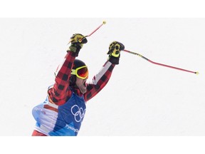 Brady Leman, of Canada, celebrates his gold medal win in the men's ski cross final at the 2018 Winter Olympic Games in Pyeongchang, South Korea, Wednesday, Feb. 21, 2018. Brady Leman will find out what it means to race as the reigning Olympic men's champion this World Cup ski cross season, if it ever starts.