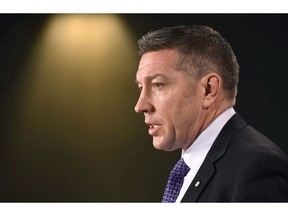 Former NHL player and child advocate Sheldon Kennedy speaks during a press conference on Parliament Hill in Ottawa on Monday, Feb. 5, 2018. Ex-NHLer and abuse survivor Sheldon Kennedy is removing his name from the child advocacy centre in Calgary he founded.