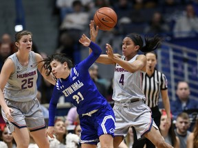 Seton Hall's Nicole Jimenez (21) loses control of the ball against Connecticut's Mikayla Coombs (4) in the first half of an NCAA college basketball game Saturday, Dec. 8, 2018, in Hartford, Conn.