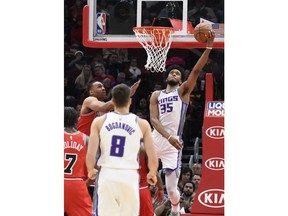 Sacramento Kings forward Marvin Bagley III (35) goes to the basket as Chicago Bulls forward Jabari Parker, left, defends him during the second half of an NBA basketball game Monday, Dec. 10, 2018, in Chicago. The Kings won 108-89.