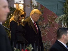President Donald Trump and first lady Melania Trump leave Blair House after visiting with the family of former President George H. W. Bush, Tuesday, Dec. 4, 2018, in Washington.