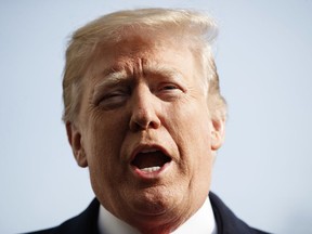 President Donald Trump talks to media before boarding Marine One on the South Lawn of the White House in Washington, Saturday, Dec. 8, 2018, for the short trip to Andrews Air Force Base en route to Philadelphia to attend the Army-Navy Football Game.