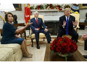 Vice President Mike Pence, center, looks on as House Minority Leader Rep. Nancy Pelosi, D-Calif., argues with President Donald Trump during a meeting in the Oval Office of the White House, Tuesday, Dec. 11, 2018, in Washington.