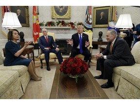 President Donald Trump and Vice President Mike Pence meet with Senate Minority Leader Chuck Schumer, D-N.Y., and House Minority Leader  Nancy Pelosi, D-Calif., in the Oval Office of the White House, Tuesday, Dec. 11, 2018, in Washington.