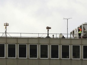 Counter drone equipment deployed on a rooftop at Gatwick airport as the airport and airlines work to clear the backlog of flights delayed by a drone incident earlier in the week, in Crawley, England,  Saturday, Dec. 22, 2018.