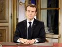 French President Emmanuel Macron waits to begin a special address to the nation, his first public comments after four weeks of nationwide 'yellow vest' protests, at the Elysee Palace, in Paris, Dec. 10, 2018.