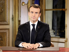 French President Emmanuel Macron waits to begin a special address to the nation, his first public comments after four weeks of nationwide 'yellow vest' protests, at the Elysee Palace, in Paris, Dec. 10, 2018.
