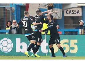 Empoli's Francesco Caputo, right, celebrates after scoring his team's first goal, during the Italian Serie A soccer match between Spal and Empoli at the Paolo Mazza stadium in Ferrara, Italy, Saturday,  Dec. 1, 2018.