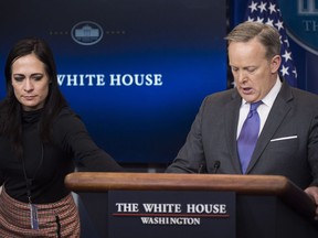 Stephanie Grisham, now communications director for first lady Melania Trump, hands White House press secretary Sean Spicer a note as he speaks during the daily news briefing at the White House in Washington on Jan. 30, 2017. MUST CREDIT: Washington Post photo by Jabin Botsford.