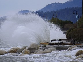 Massive waves hit the seawall as storms surges on West Vancouver's  Ambleside beach area at high tide on December 17, 2012.
