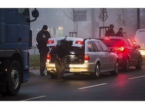 Police control the border between Germany and France in Kehl, southern Germany, Wednesday, Dec. 12, 2018 the morning  after a suspected extremist sprayed gunfire at one of Europe's most famous Christmas markets in the eastern city of Strasbourg, killing three and wounding at least 13.