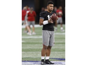 Alabama quarterback Tua Tagovailoa (13) attends an open practice one day before the Southeastern Conference Championship NCAA college football game against Georgia in Atlanta, Friday, Nov. 30, 2018.