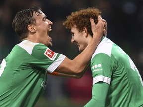 Werder Bremen's Josh Sargent, right, celebrates with Max Kruse after scoring a goal against Fortuna Duesseldorf during a Bundesliga soccer match, Friday, Dec. 7, 2018, in Bremen, Germany. Werder Bremen on 3-1.