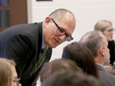 High school teacher Peter Vlaming chats at a West Point School Board hearing in West Point, Va., on Dec. 6, 2018.