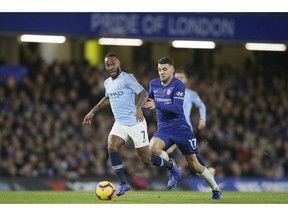 Manchester City's Raheem Sterling, left, runs with the ball following by Chelsea's Mateo Kovacic during the English Premier League soccer match between Chelsea and Manchester City at Stamford Bridge in London, Saturday Dec. 8, 2018.