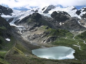 In this photo provided by James Balog/Extreme Ice Survey and Matthew Kennedy, the Stein glacier in Switzerland in 2015. Over the past decade or so scientists and photographers keep returning to the world’s glaciers, watching them shrink with each visit. Now they want other people to see what haunts them in a series of before and after photos.