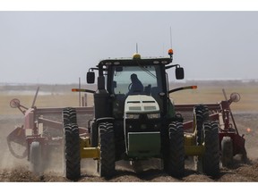 FILE- In this Sept. 19, 2018, file photo a tractor operator picks potatoes at Brett Jensen Farms outside of Idaho Falls, Idaho. On Tuesday, Dec. 12, the Labor Department reports on U.S. producer price inflation in November.