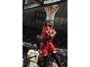 Maryland forward Bruno Fernando (23) dunks in front of Purdue forward Aaron Wheeler (1) during the first half of an NCAA college basketball game in West Lafayette, Ind., Thursday, Dec. 6, 2018.