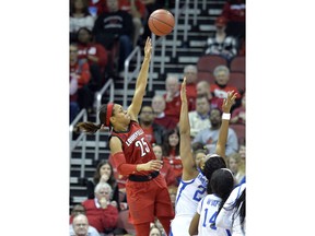 Louisville guard Asia Durr (25) shoots over the defense of Kentucky forward Ogechi Anyagaligbo (21) during the first half of an NCAA college basketball game in Louisville, Ky., Sunday, Dec. 9, 2018.