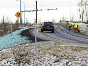 A car ascends a newly repaired off-ramp of Minnesota Drive on Wednesday, Dec. 5, 2018, in Anchorage, Alaska. A massive 7.0 earthquake and its aftershocks rocked buildings and buckled roads Nov. 30, including the road that's a route to Ted Stevens Anchorage International Airport. Alaska transportation officials made rebuilding the ramp a priority. It reopened Tuesday, Dec. 4, and a crew completed shoulder work Wednesday.