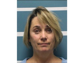 This Wednesday, Dec. 5, 2018, photo released by Tulare County Sheriff's Office shows Margaret Gieszinger, a high school teacher in central California who was arrested on suspicion of felony child endangerment,after forcibly cutting the hair of one of her students while singing the National Anthem, authorities said. Gieszinger was arrested Wednesday, after videos posted to social media showed a student at University Preparatory High School in the city Visalia sitting in a chair at the front of the classroom as Gieszinger cuts his hair. Gieszinger is being held on $100,000 bail. It was not immediately known if she has an attorney.