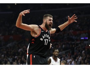Toronto Raptors' Jonas Valanciunas (17) reacts after scoring against the Los Angeles Clippers during the first half of an NBA basketball game, Tuesday, Dec. 11, 2018, in Los Angeles.