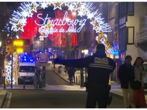 In this image made from video, emergency services arrive on the scene of a Christmas market in Strasbourg, France, Tuesday, Dec. 11, 2018. A French regional official says that a shooting in Strasbourg has left at least one dead and several wounded in the city center near a world-famous Christmas market. The prefect of France's Bas-Rhin region says the gunman, who is still at large, has been identified. Authorities haven't given a motive for the shooting. (AP Photo)