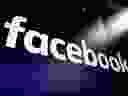 FILE - In this file photo dated March 29, 2018,  the logo for social media giant Facebook, appears on screens at the Nasdaq MarketSite, in New York's Times Square. The British Parliament's media committee seized confidential Facebook documents from a developer and on Wednesday Dec. 5, 2018, has released a cache of documents that show Facebook considered charging developers for data access.