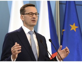 FILE - In this file photo dated Monday, Oct. 15, 2018, Polish Prime Minister Mateusz Morawiecki speaks to the press in Warsaw, Poland.  Morawiecki has asked for a confidence vote on his own government, Wednesday Dec. 12, 2018, saying he wants to be sure that his government has "a mandate" ahead of a European Union summit on upcoming Thursday.