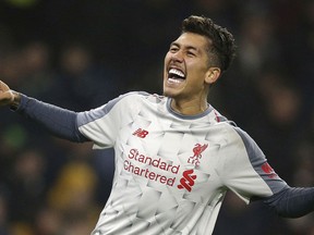 Liverpool's Roberto Firmino celebrates scoring his side's second goal of the game against Burnley, during their English Premier League soccer match at Turf Moor in Burnley, England, Wednesday Dec. 5, 2018.
