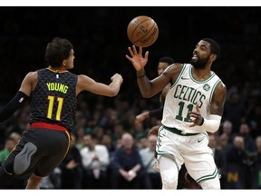 Boston Celtics guard Jaylen Brown (7) drives against New York Knicks center Enes Kanter (00) during the first quarter of an NBA basketball game Thursday, Dec. 6, 2018, in Boston.