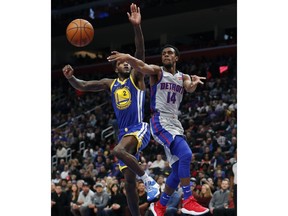 Detroit Pistons guard Ish Smith (14) passes as Golden State Warriors forward Jordan Bell (2) defends during the first half of an NBA basketball game, Saturday, Dec. 1, 2018, in Detroit.