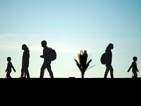 Silhouettes of migrants, part of an art installation, at the grounds of the International conference on Global Compact for Migration in the Moroccan city of Marrakech.