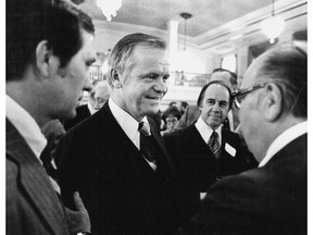 In a January 23, 1977 photo, Agriculture Secretary Bob Bergland, center, talks with guests at a National Press Club reception. Former U.S. Agriculture Secretary Bob Bergland died Sunday, Dec. 9, 2018 at a nursing home in Roseau, in northern Minnesota according to his daughter, Linda Vatnsdal. He was 90.