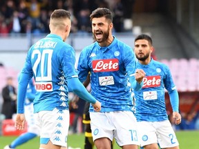 Napoli's Piotr Zielinski, left, celebrates with teammate Sebastian Luperto after scoring during the Serie A soccer match between Napoli and Frosinone, at the San Paolo stadium in Naples, Italy, Saturday, Dec. 8, 2018.