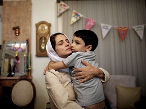 Iranian human-rights lawyer Nasrin Sotoudeh hugs her son, Nima, at her home in Tehran on Sept. 18, 2013, after being freed after three years in prison.  She was sentenced to five more years in prison in June 2018.