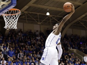 Duke's RJ Barrett drives for a dunk against Yale during the second half of an NCAA college basketball game in Durham, N.C., Saturday, Dec. 8, 2018. Duke won 91-58.