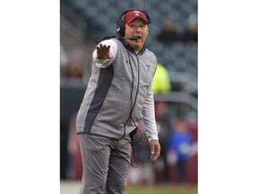 FILE - In this Nov. 18, 2017, file photo, Temple head coach Geoff Collins gestures to his team during the third quarter of an NCAA college football game against Central Florida, in Philadelphia. Georgia Tech has hired Temple coach Geoff Collins to replace Paul Johnson as the Yellow Jackets coach. Collins, a Conyers, Georgia native, is a former Florida and Mississippi State defensive coordinator who was 15-10 in two seasons at Temple. Georgia Tech announced the hire on Friday, Dec. 7, 2018,  and planned a news conference for later in the day.