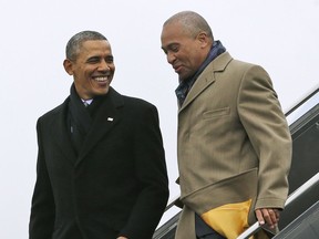 FILE - In this March 5, 2014 file photo, President Barack Obama, left, speaks with Massachusetts Gov. Deval Patrick upon arrival on Air Force One at Boston Logan International Airport in Boston. Several sources confirmed Wednesday, Dec. 5, 2018, that Patrick will soon announce he will not launch a presidential campaign in 2020.