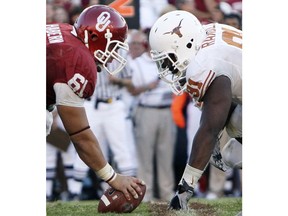 FILE - In this Oct. 2, 2010, file photo, Texas defensive tackle Kheeston Randall (91) and Oklahoma offensive lineman Ben Habern (61) face off at the line of scrimmage during an NCAA college football game at the Cotton Bowl in Dallas. No. 5 Oklahoma and No. 9 Texas are playing in a rare Red River rivalry rematch in the Big 12 championship game on Saturday. It is the first time in 115 years that the border state rivals will play twice in the same season.