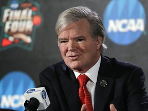 FILE - In this March 29, 2018, file photo, NCAA President Mark Emmert speaks during a news conference at the Final Four NCAA college basketball tournament in San Antonio. Emmert says new rules allowing the association to use information from legal proceedings will help its investigation of the college basketball corruption, but the inquiry is unlikely to be completed before the next men's tournament.