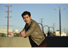 In this Nov. 9, 2018 photo, actor Henry Golding poses for a portrait at the Orlando Hotel in Los Angeles. Golding, who starred in the hit film, "Crazy Rich Asians," was named as one of 2018's Breakthrough Entertainers of the Year by the Associated Press.