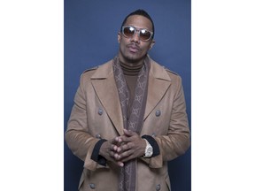 In this Dec. 10, 2018 photo, Nick Cannon poses for a portrait in New York to promote promoting his new show, "The Masked Singer."