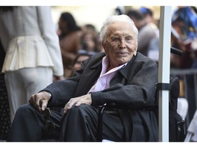 FILE - In this Nov. 6, 2018 file photo, actor Kirk Douglas attends a ceremony honoring his son actor Michael Douglas with a star on the Hollywood Walk of Fame in Los Angeles. Public officials and relatives of Douglas have unveiled a new historic marker in his upstate New York birthplace to honor the Hollywood legend on his birthday. The blue and yellow New York state historic marker was presented in Amsterdam on Sunday, the actor's 102nd birthday. The sign will be erected near the home where he was born as Issur Danielovitch to Russian Jewish parents on Dec. 9, 1916.