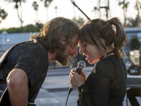 This image released by Warner Bros. shows Bradley Cooper, left, and Lady Gaga in a scene from the latest reboot of the film, "A Star is Born." On Thursday, Dec. 6, 2018, the film was nominated for a Golden Globe award for best motion picture drama. The 76th Golden Globe Awards will be held on Sunday, Jan. 6.