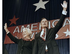 FILE - In this Nov. 8, 1988 file photo, President-elect George H.W. Bush and his wife Barbara wave to supporters in Houston, Texas after winning the presidential election. Bush has died at age 94. Family spokesman Jim McGrath says Bush died shortly after 10 p.m. Friday, Nov. 30, 2018, about eight months after the death of his wife, Barbara Bush.