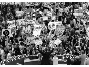 FILE - In this July 16, 1980 file photo George H.W. Bush, center foreground, acknowledges the crowd before speaking to the Republican Convention delegates in Detroit, Mich. Bush died at the age of 94 on Friday, Nov. 30, 2018, about eight months after the death of his wife, Barbara Bush. (AP Photo/File)