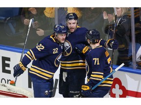 Buffalo Sabres forward Zemgus Girgensons (28) celebrates his goal with teammates during the first period of an hockey game against the Los Angeles Kings, Tuesday, Dec. 11, 2018, in Buffalo N.Y.