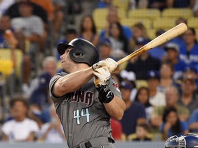 FILE - In this Aug. 31, 2018 file photo Arizona Diamondbacks' Paul Goldschmidt hits a two-run home run during the first inning of a baseball game against the Los Angeles Dodgers in Los Angeles. The St. Louis Cardinals have acquired Goldschmidt from the Diamondbacks in a multiplayer trade. The Cardinals sent pitcher Luke Weaver, catcher Carson Kelly, minor league infielder Andy Young and a 2019 draft pick to Arizona in the deal Wednesday, Dec. 5, 2018.